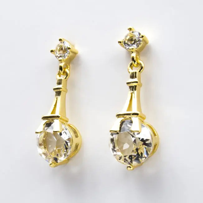 Boucles dorées à pendentif Tour Eiffel et cristaux Swarovski® lumineux. Bijou fantaisie raffiné pour un cadeau plein de charme.