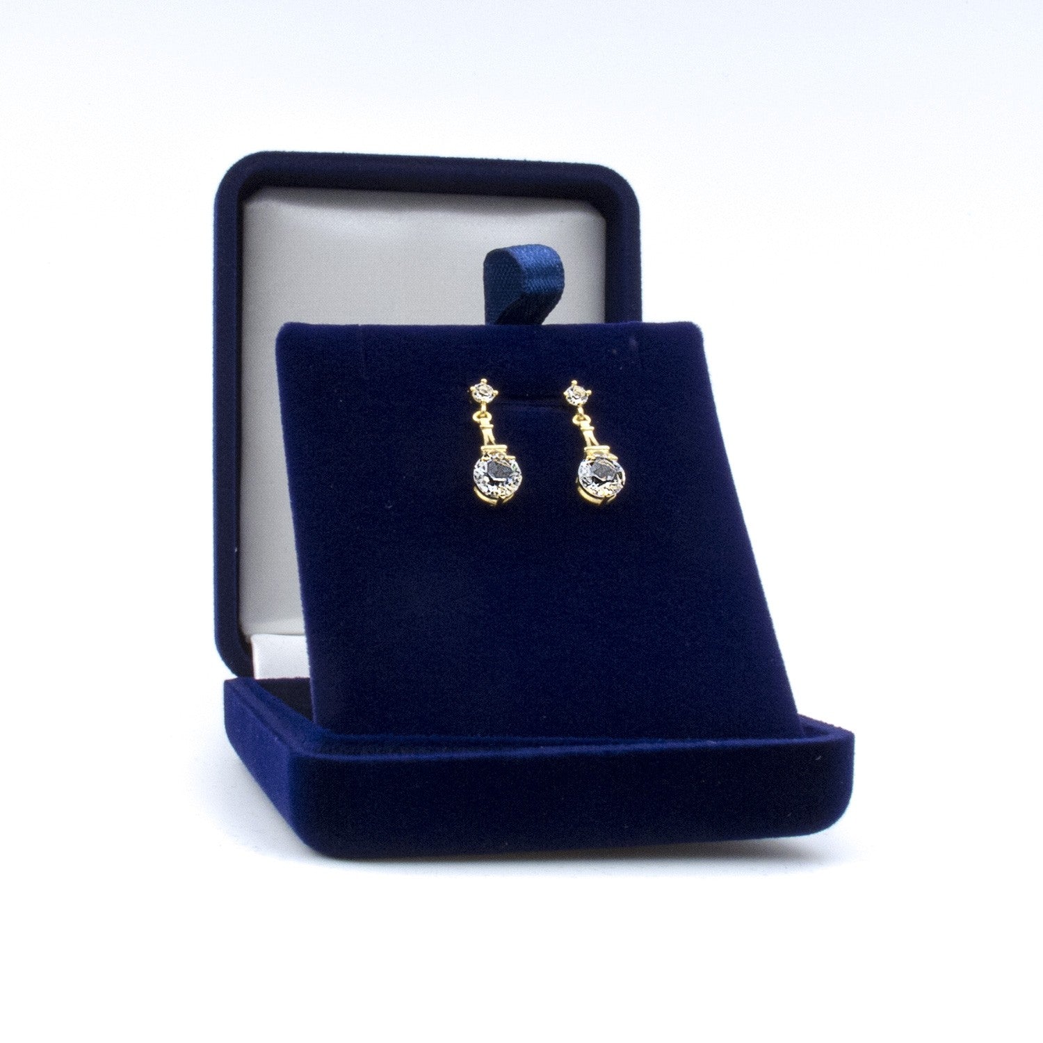 Boucles dorées avec Tour Eiffel sertie de cristaux Swarovski®, livrées dans un coffret bleu nuit. Cadeau chic et élégant à personnaliser.