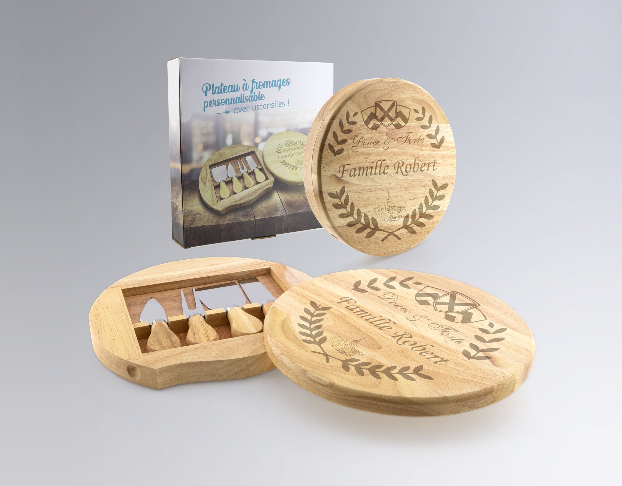 Plateau à fromages personnalisable en bois gravé avec ustensiles inclus, présenté dans son coffret, idéal pour un cadeau familial original.