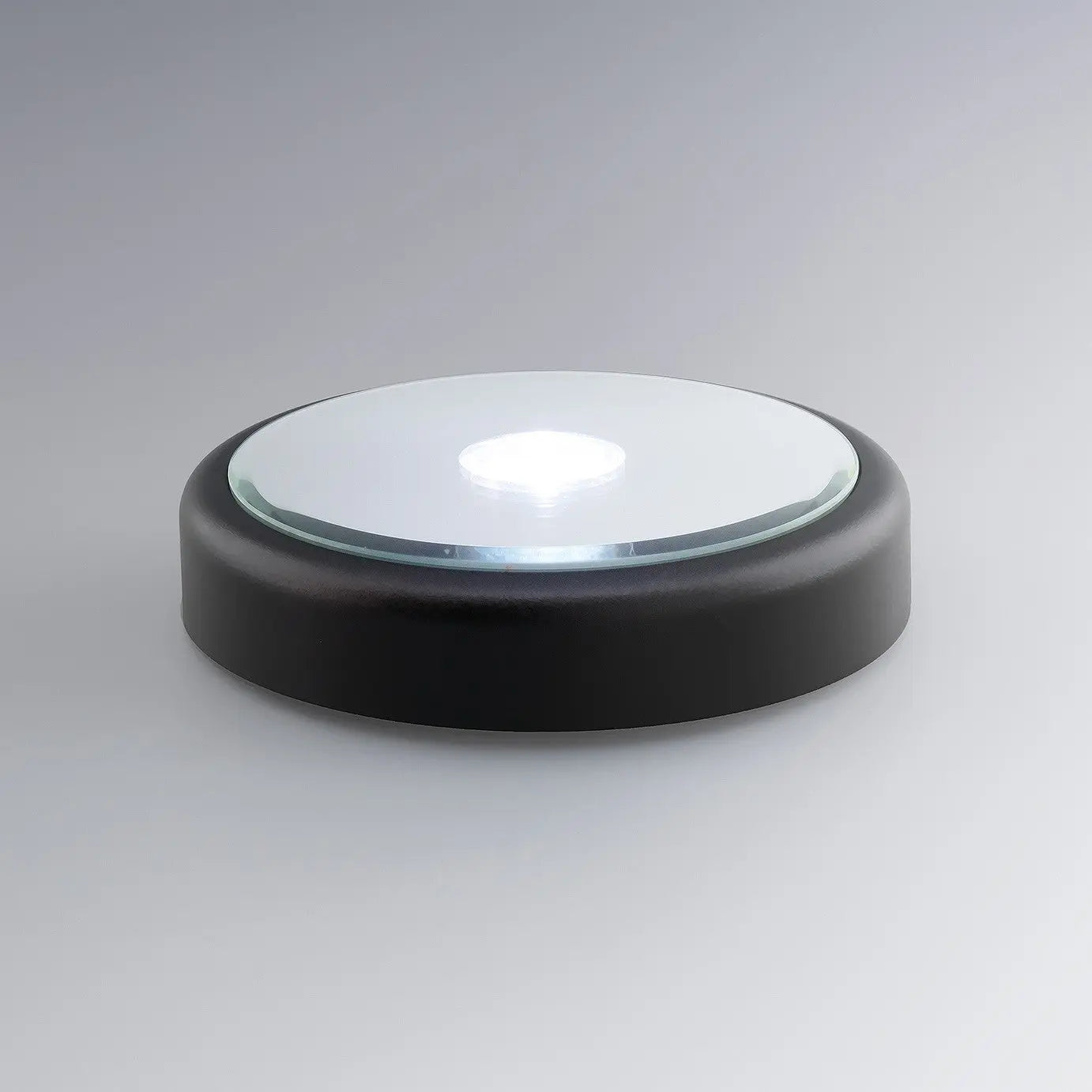 Un socle rond à LED blanc illumine les blocs gravés en 3D. Compatible avec formats cube, cœur ou demi-lune, il sublime toutes les gravures personnalisées.