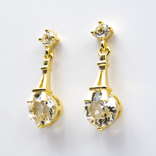 Boucles dorées à pendentif Tour Eiffel et cristaux Swarovski® lumineux. Bijou fantaisie raffiné pour un cadeau plein de charme.