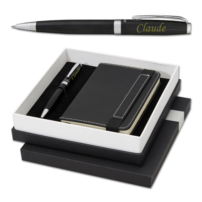 Coffret cadeau luxe contenant un stylo à bille noir personnalisé et un carnet noir assorti, parfait pour un cadeau professionnel ou personnel.