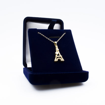 Écrin cadeau contenant un pendentif Tour Eiffel Cœur plaqué or, décoré de cristaux scintillants, parfait pour offrir.