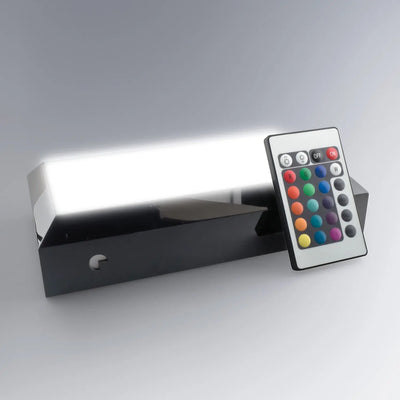 Socle lumineux rectangle interactif allumé en blanc vif avec télécommande. Idéal pour les vitrines ou présentations, il valorise parfaitement tout bloc en verre.