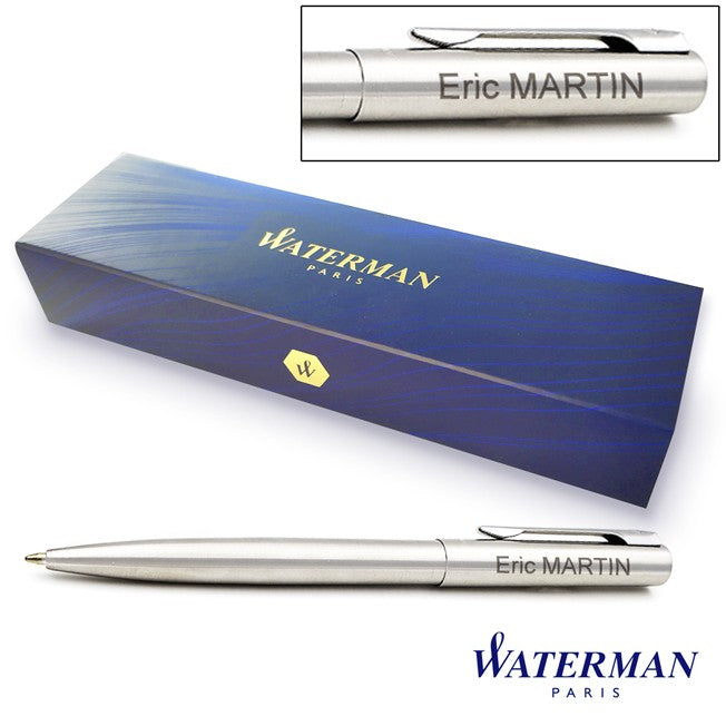Stylo bille Waterman Graduate avec gravure personnalisée "Eric MARTIN", présenté devant son coffret bleu Waterman Paris au design raffiné. Un cadeau élégant et professionnel.